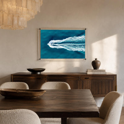 Blue ocean acrylic wall art with an aerial speedboat scene
