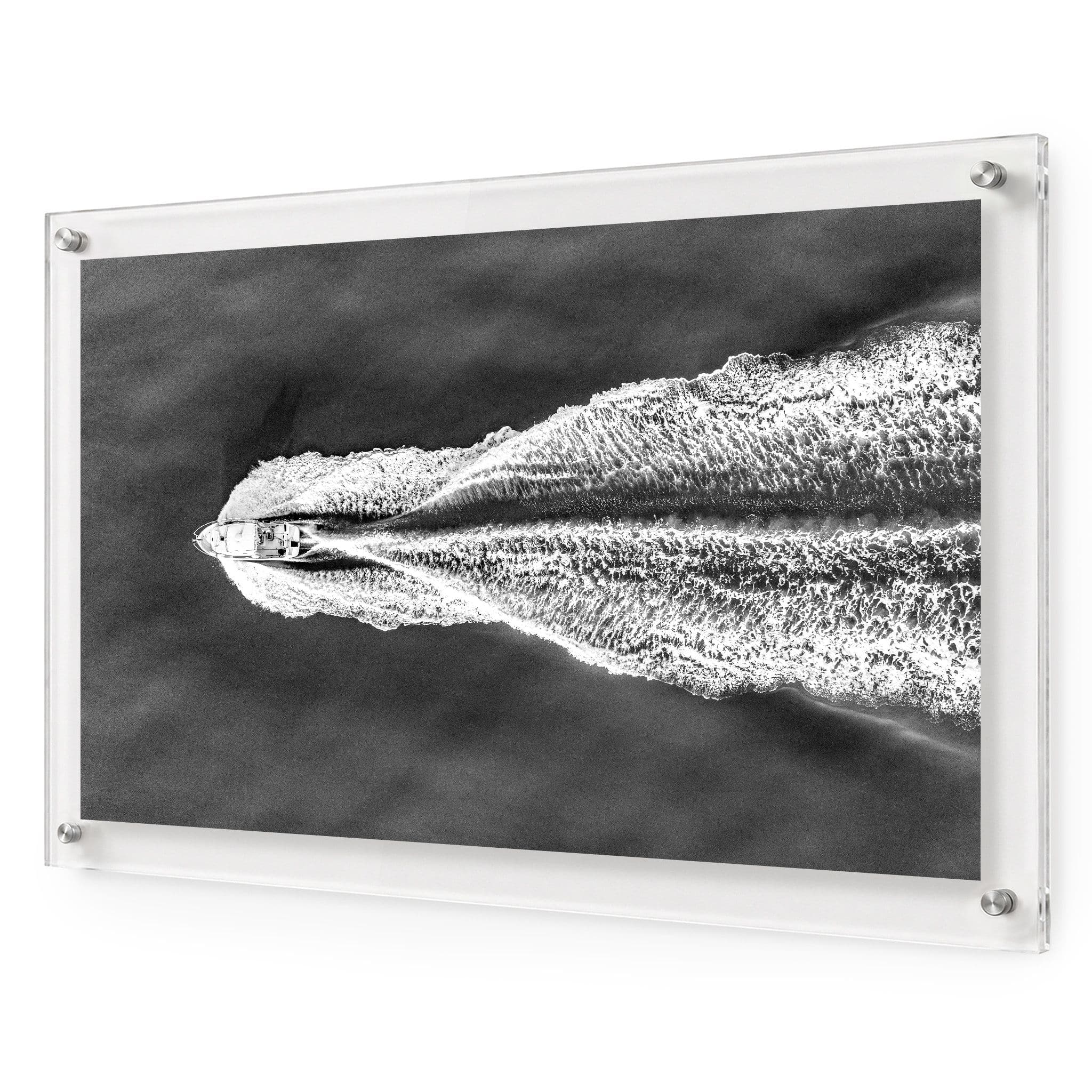 The Getaway black and white acrylic wall art featuring a speedboat on open water