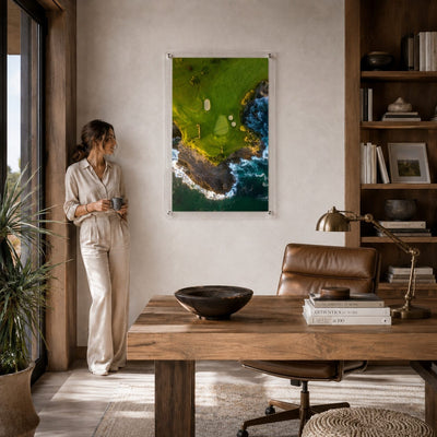 coastal hazard acrylic wall art print hanging in office with woman standing