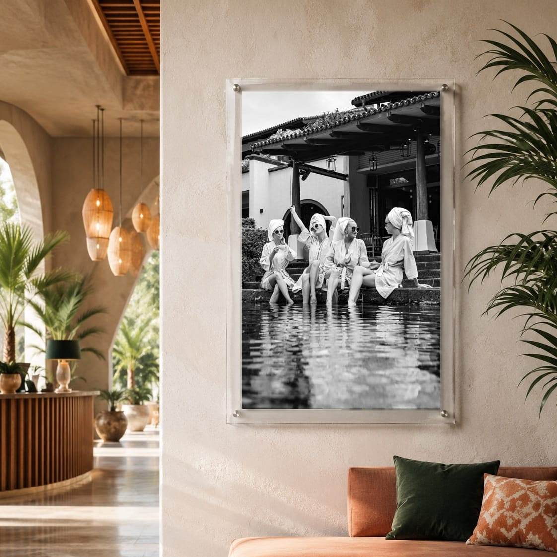 Vertical black and white wall art with women enjoying a resort pool