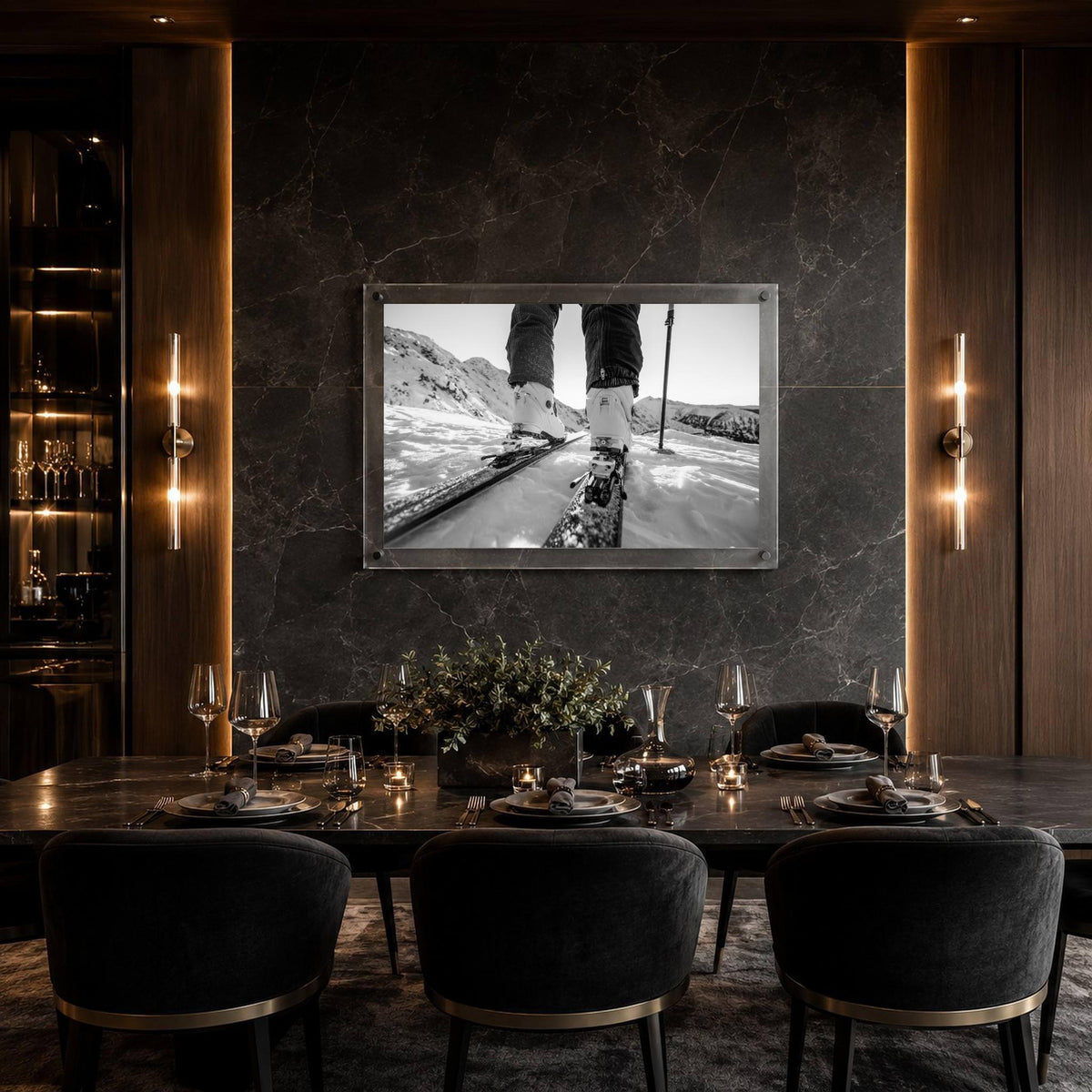 Black and white mountain road wall art in a modern black dining table and upholstered chairs