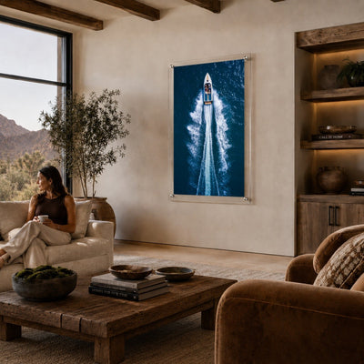 Exit By Sea wall art displayed in a warm modern living room with woman