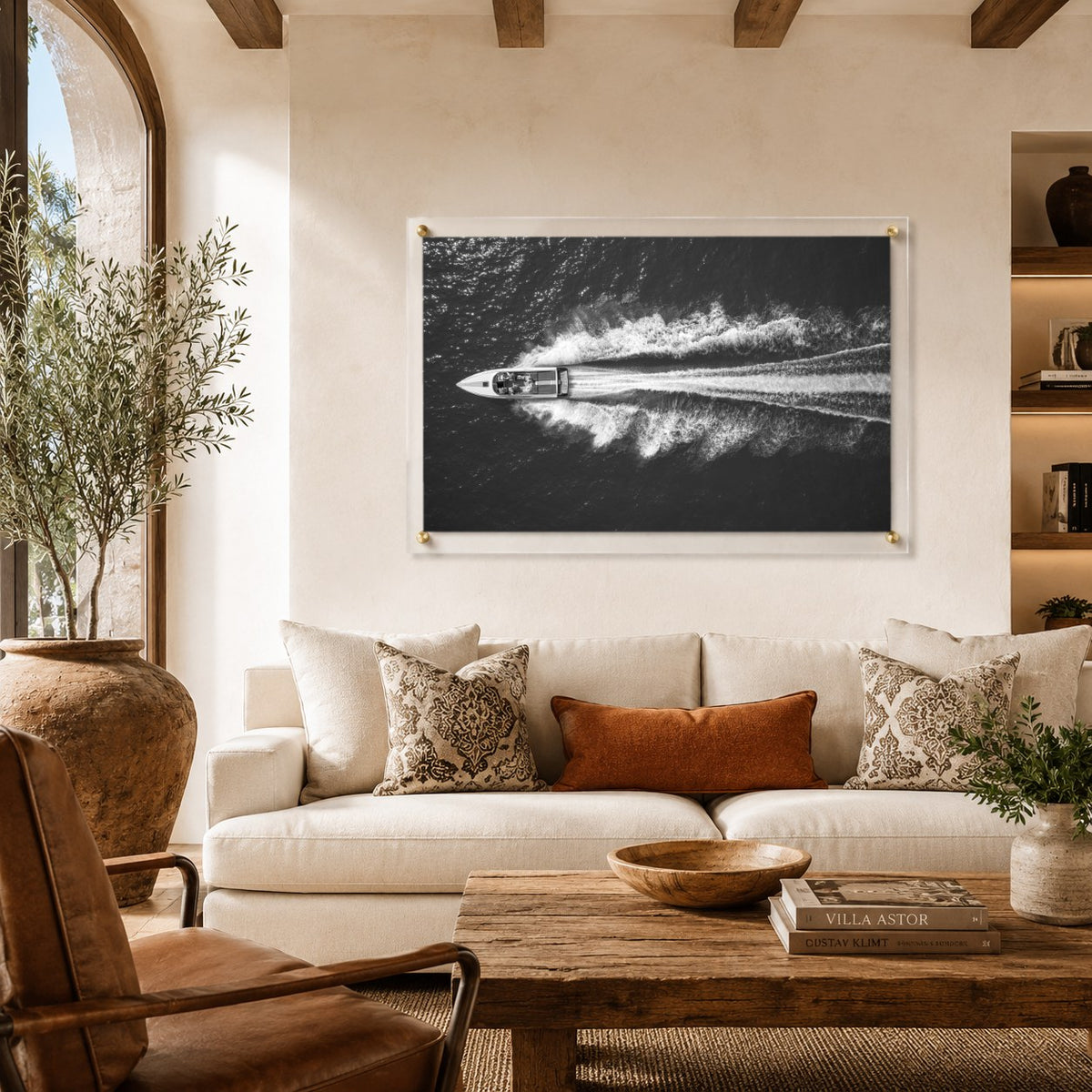 Exit By Sea wall art displayed above a cozy sofa in a bright living room