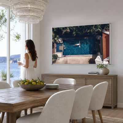 Lap of Luxury wall art in a bright modern dining room setting with woman standing