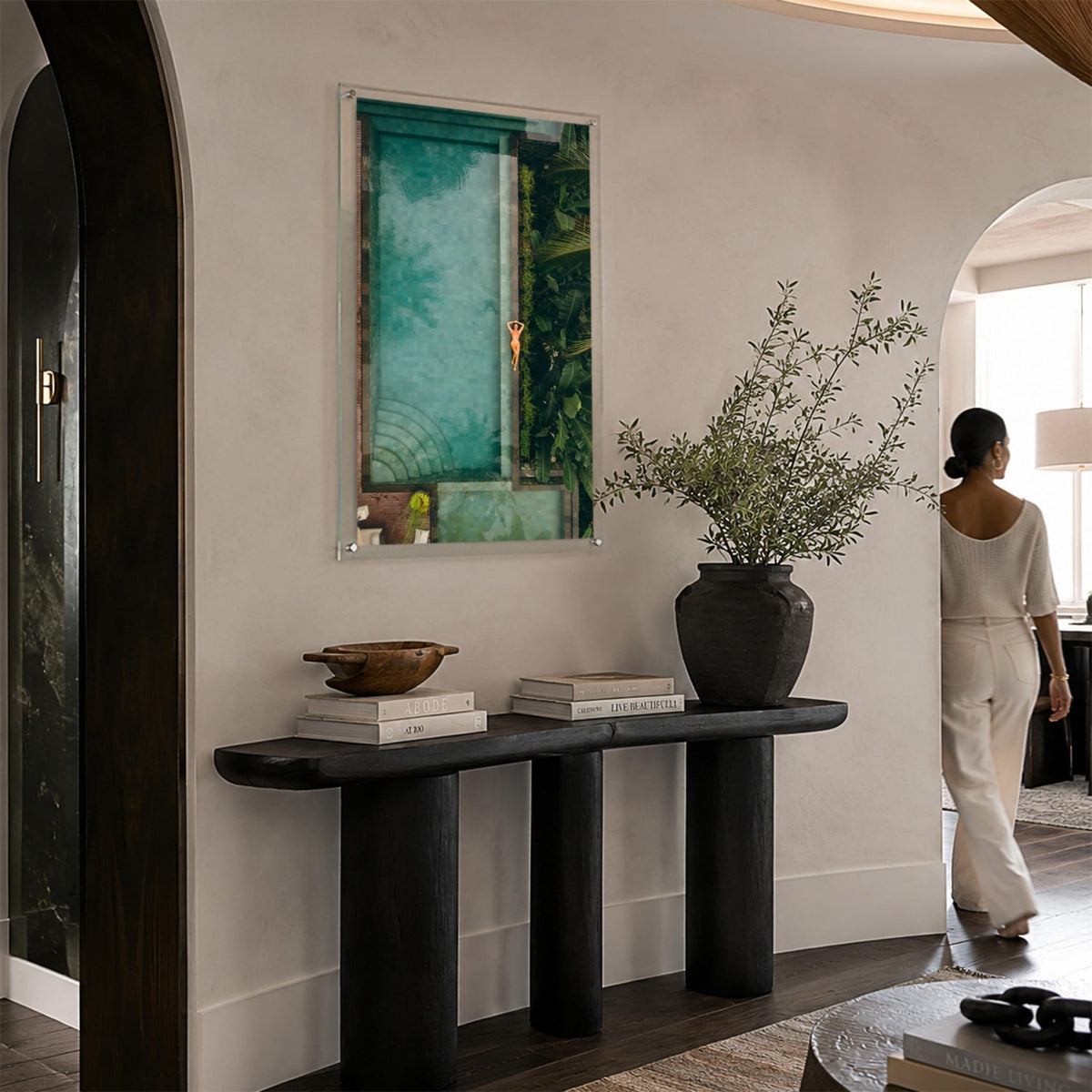 Palm and Circumstance wall art in an elegant modern foyer space with woman aside