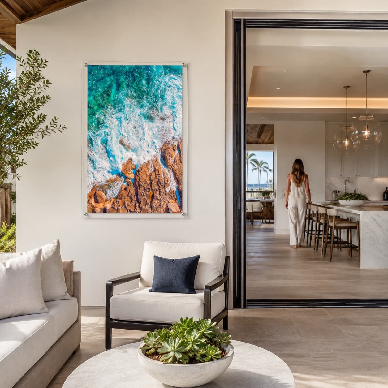 Foam and Fire wall art displayed in a bright modern living room setting with woman afar