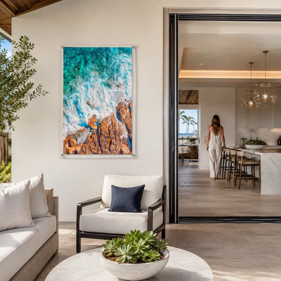 Foam and Fire wall art displayed in a bright modern living room setting with woman afar