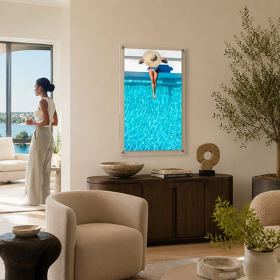 The Temperature Check acrylic wall art in a bright coastal living room with woman aside