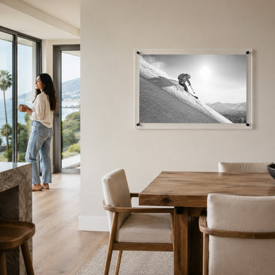 Steep Thrills acrylic wall art in a bright dining room setting with woman standing