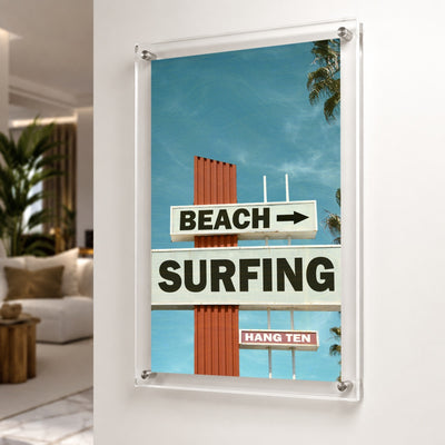 Next Stop Surf acrylic wall art shown in a neutral living room setting