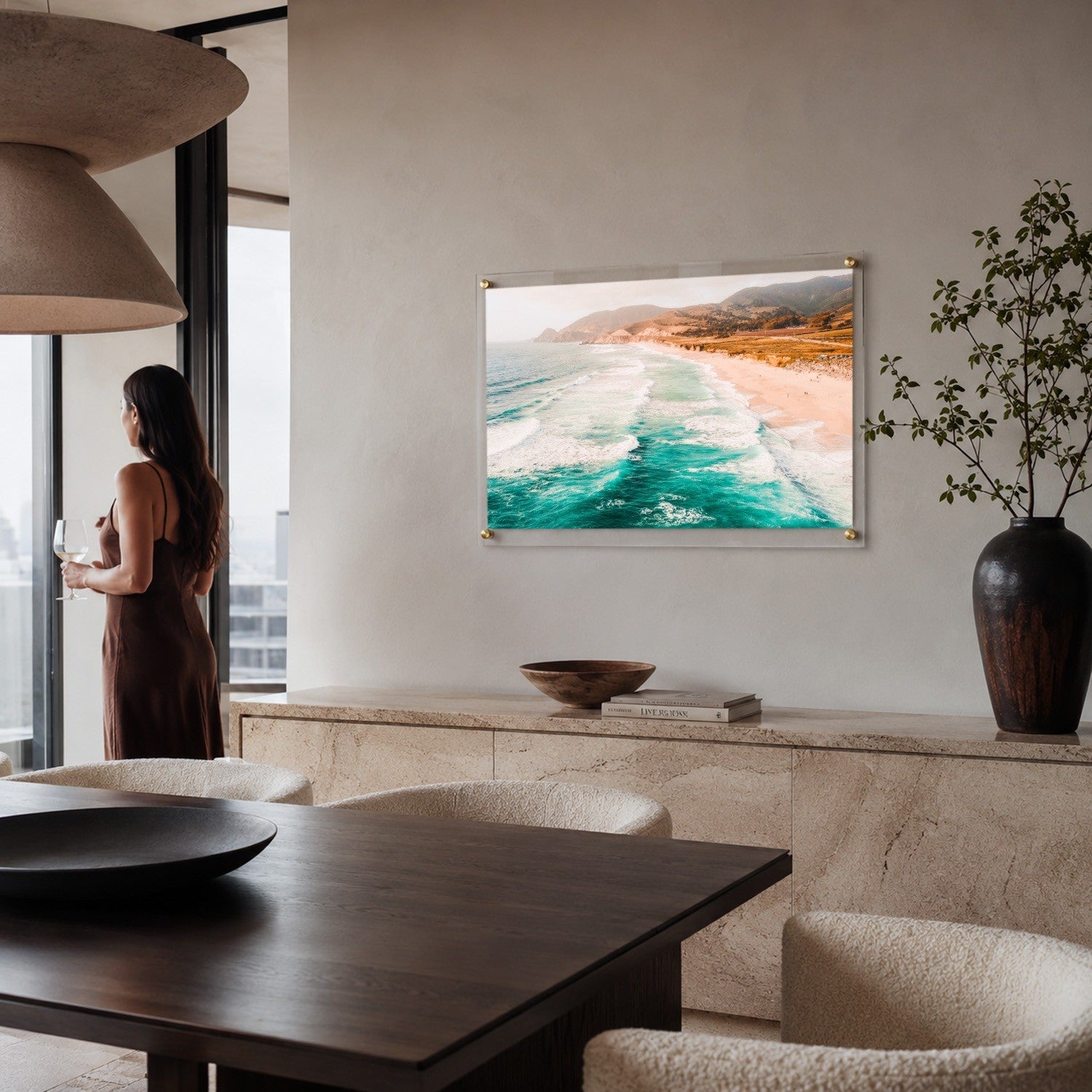 Pacific Pastels acrylic wall art displayed above a modern living space with woman standing aside