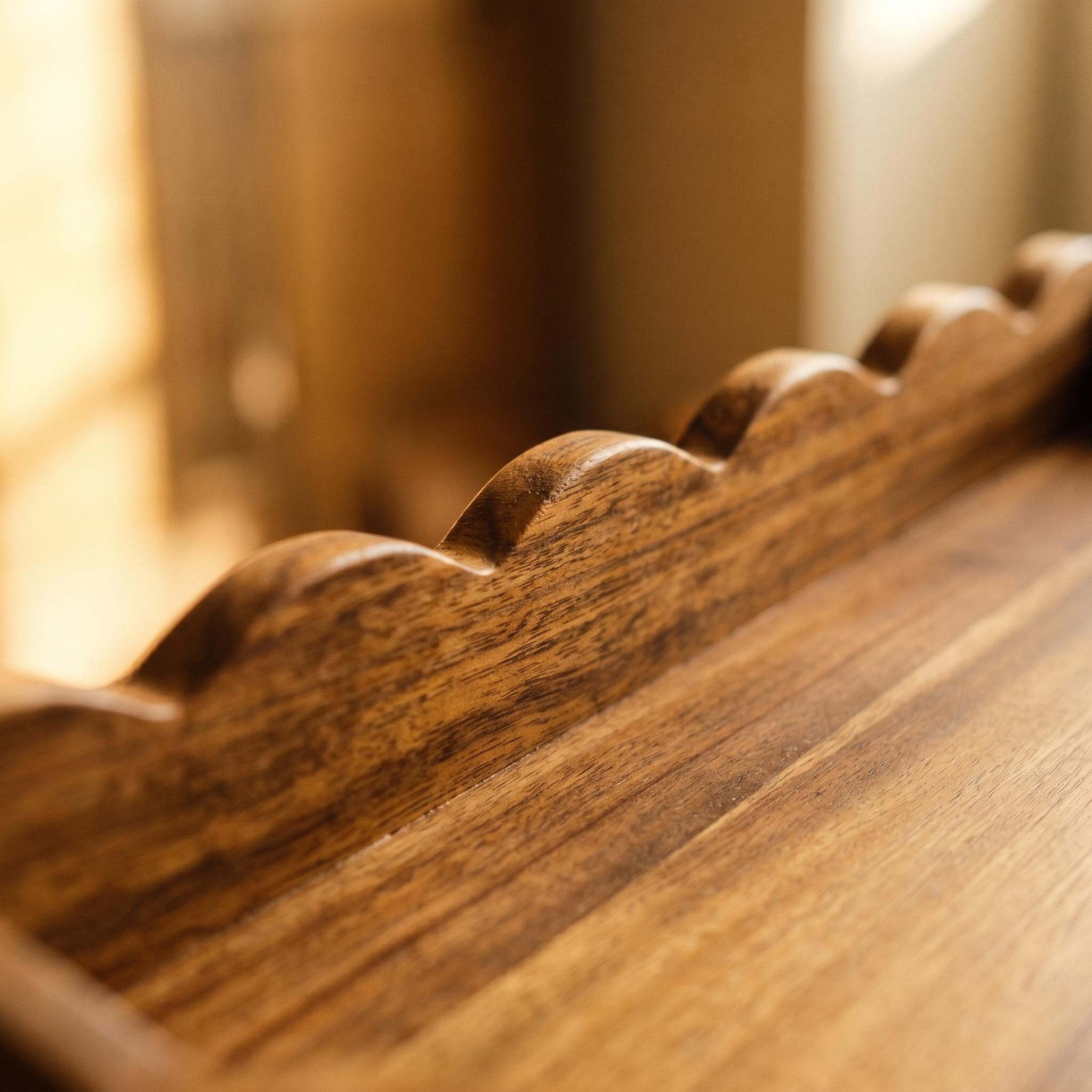 Detailed view of the scalloped wooden serving tray