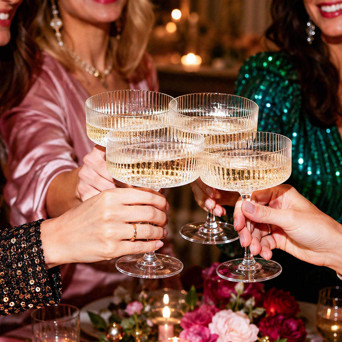 women toasting with Fitzroy champagne coupe glasses