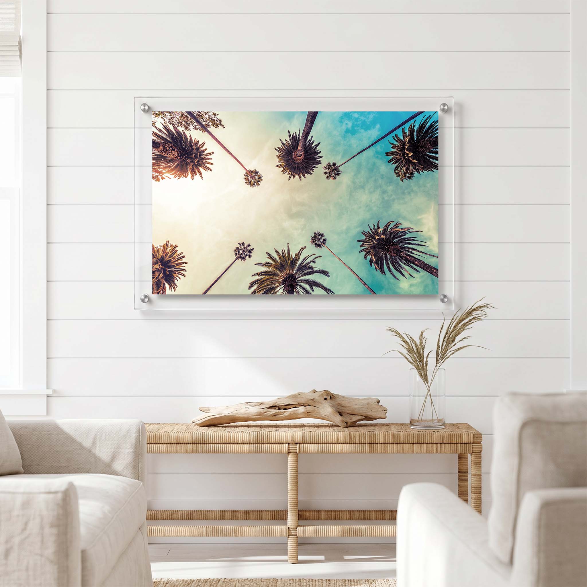 Tropical wall decor with tall palm trees displayed in a bright living room