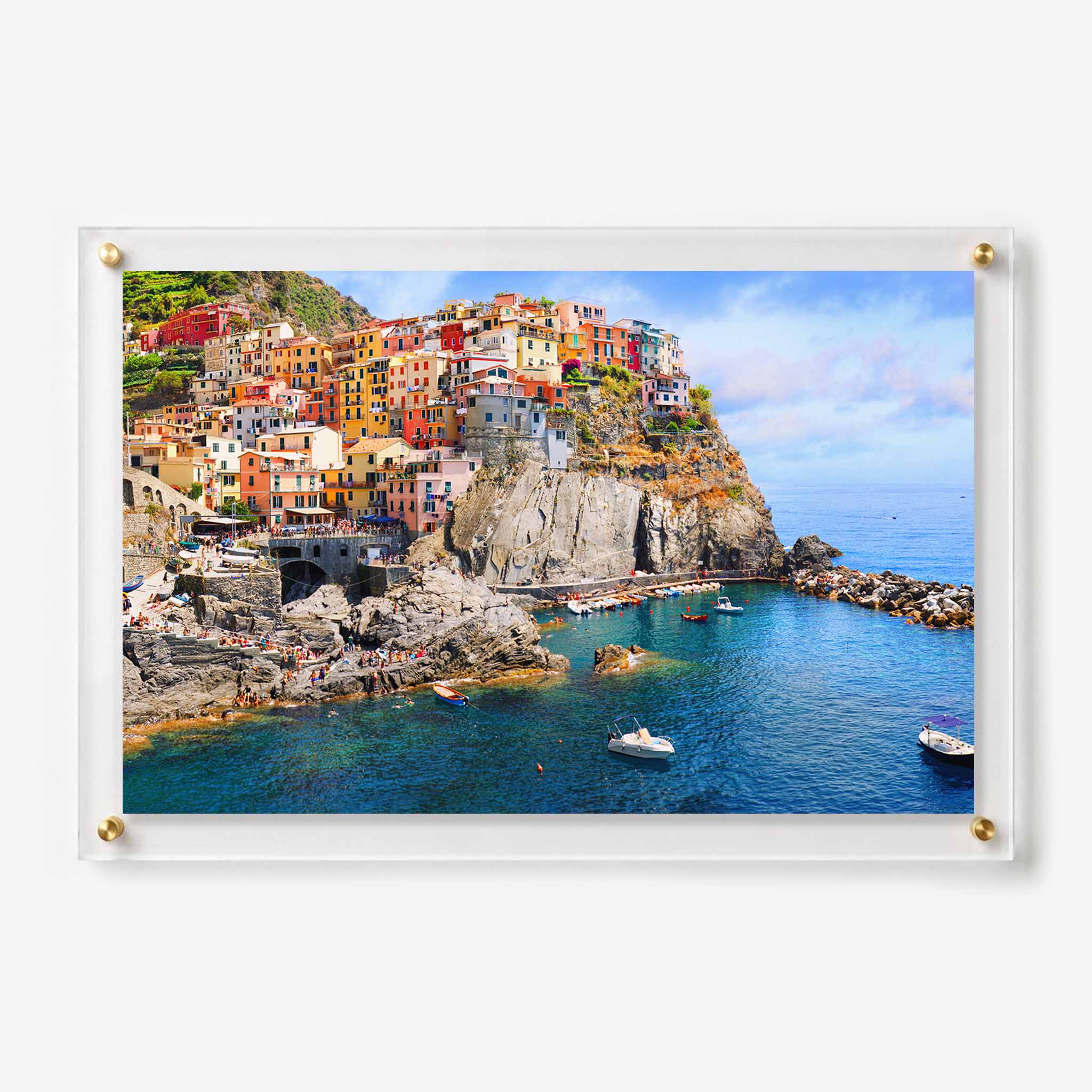 Acrylic wall art featuring colorful cliffside homes overlooking the blue sea along the Italian coast