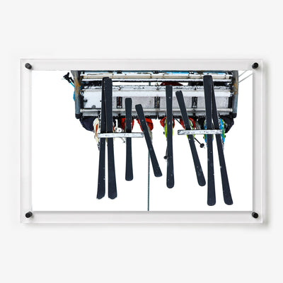 Acrylic wall art featuring skiers riding a chairlift