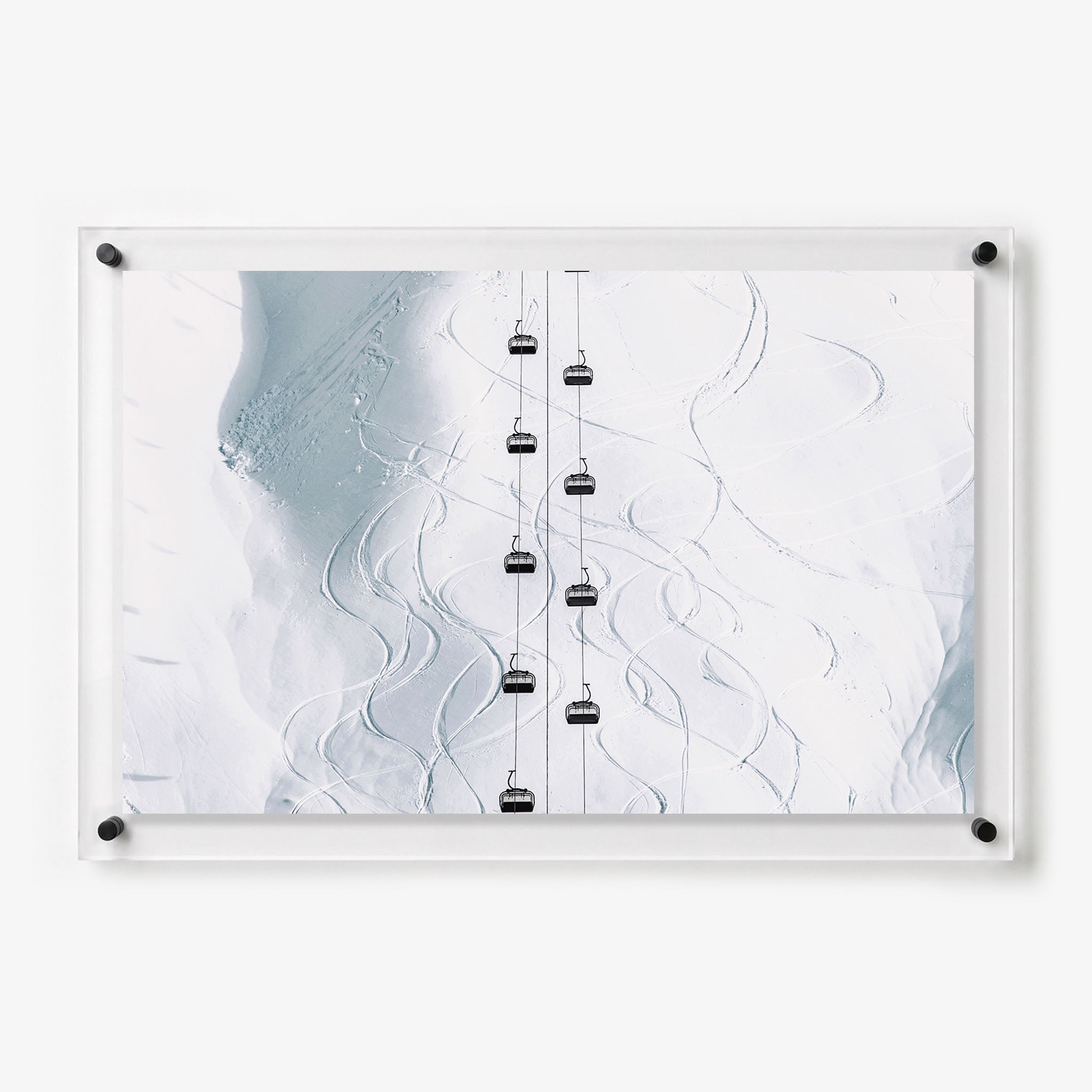 Acrylic wall art featuring ski lifts above a snowy mountain