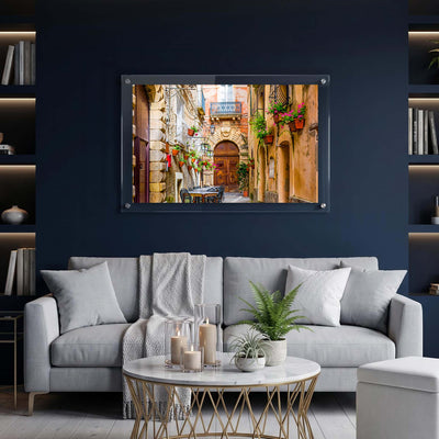Clear acrylic wall print featuring a cozy old world alley displayed in living room