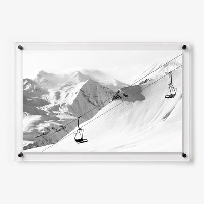Black and white acrylic wall art featuring empty ski lifts