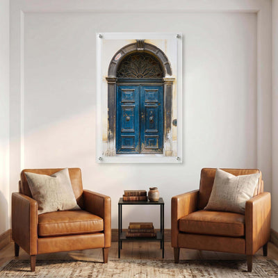 Acrylic wall art of an old blue door displayed in a contemporary room