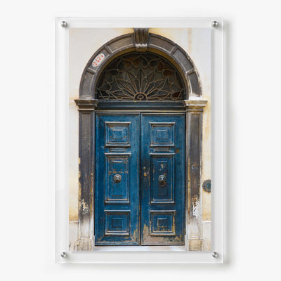 Acrylic wall art featuring a blue double door with an arched entrance