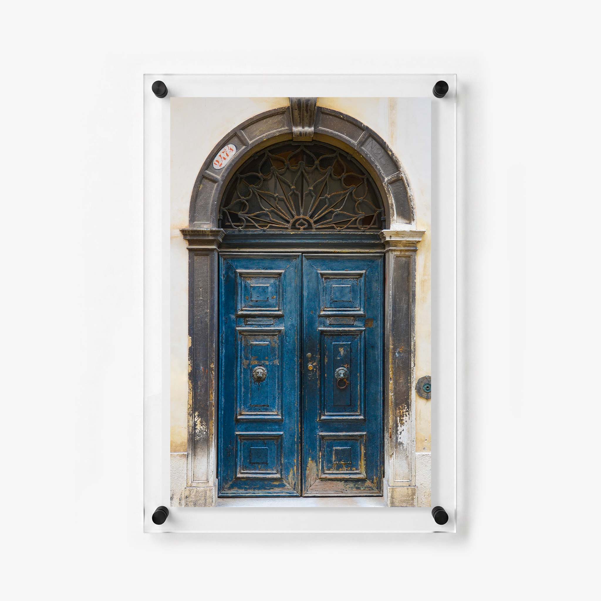 Rustic doorway wall art featuring a deep blue entrance