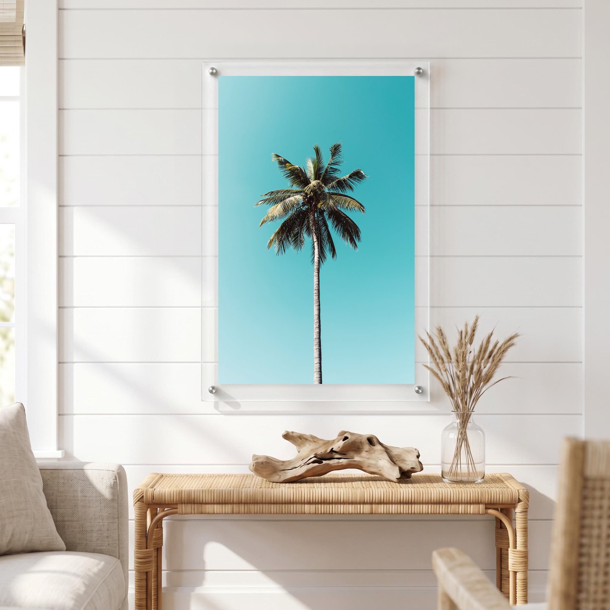 Minimalist tropical wall art showing a lone palm tree displayed in a bright room
