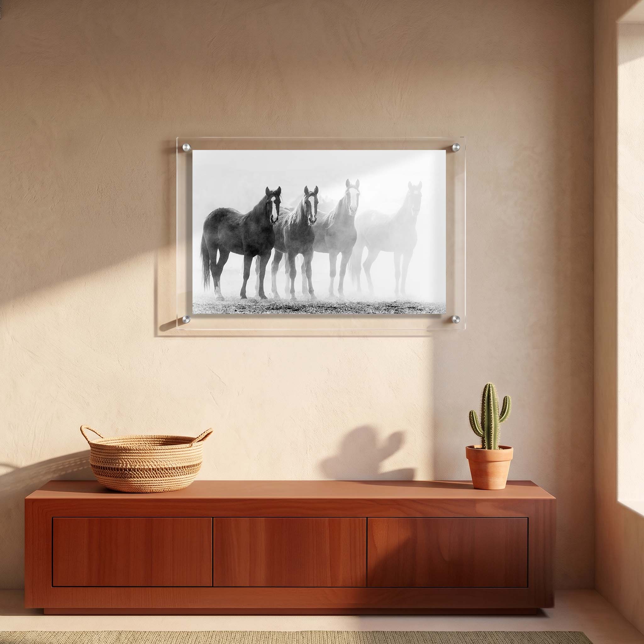Acrylic wall art of horses standing quietly as their silhouettes fade displayed in an entryway