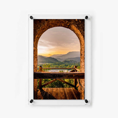 Old world archway framing a warm sunset view