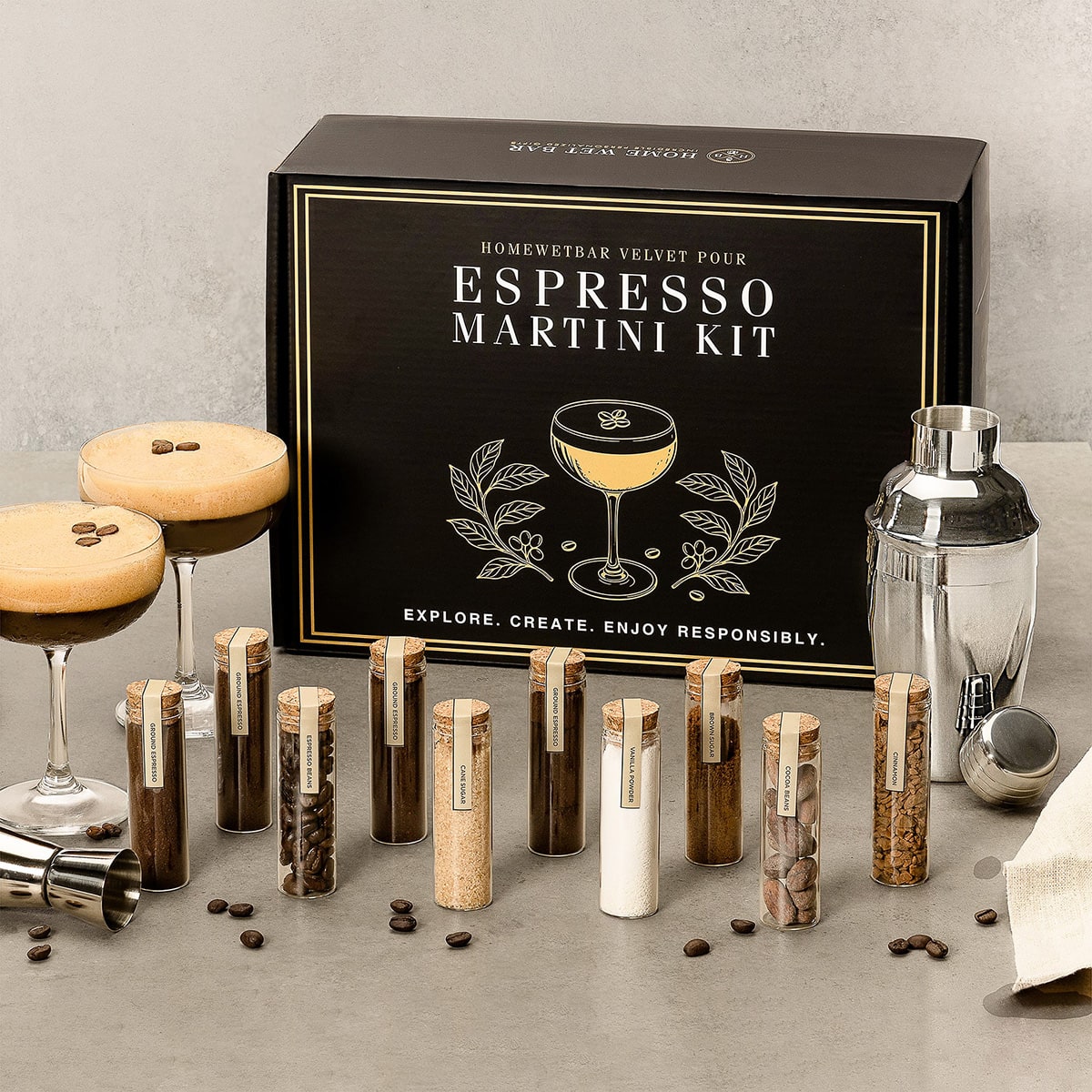 Espresso Martini cocktail kit box, glasses and ingredients on table