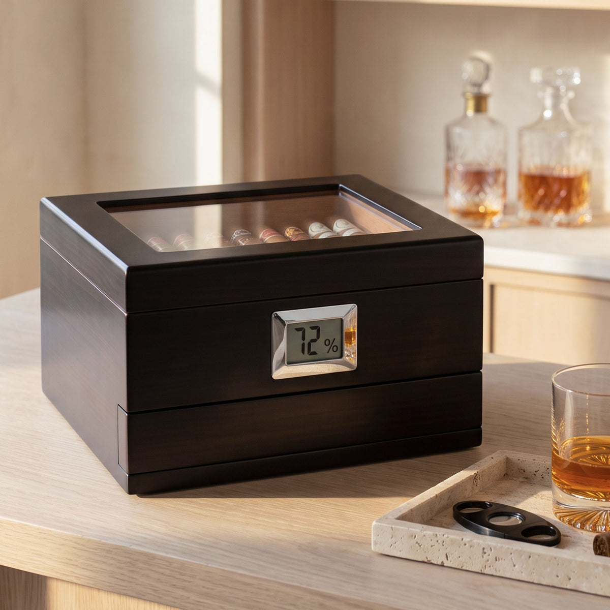 dark wood cigar humidor with glass top on home bar counter