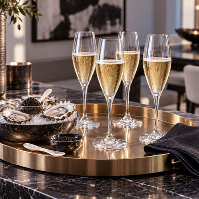 elegant champagne flutes displayed with oysters and caviar