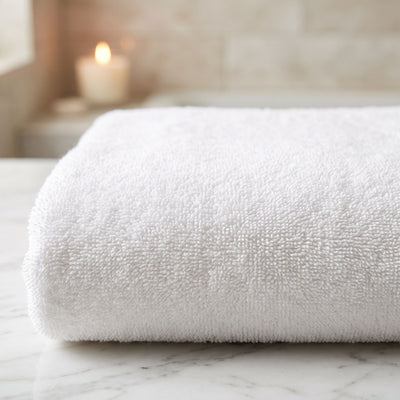 Close up of a folded white Turkish cotton bath towel