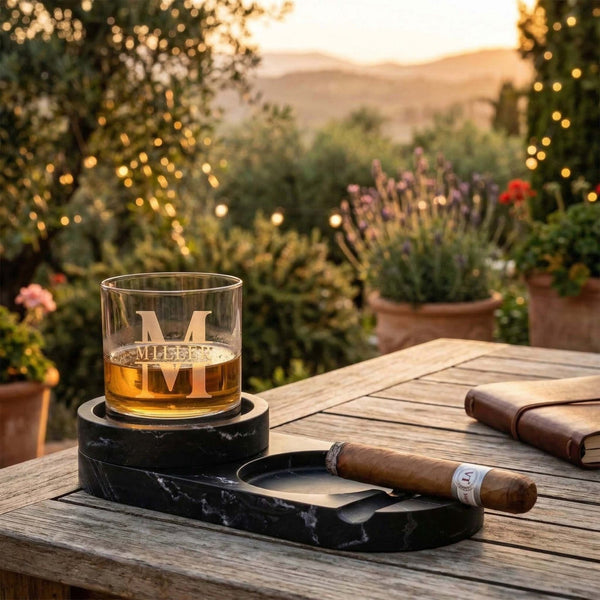 Bolton Cigar Ashtray w/ Whiskey Holder - Marble with a whiskey glass in an outdoor setting