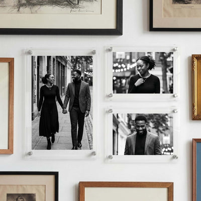 Acrylic photo print display featuring three black and white couple portraits