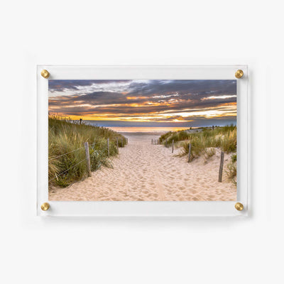 Sunset beach wall art featuring grassy dunes, wooden posts, and a calm ocean horizon