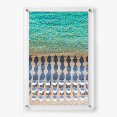 Acrylic wall art featuring an aerial view of white beach umbrellas
