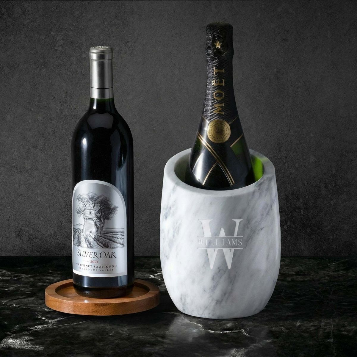 reed slanted marble wine chiller with bottles and wooden coaster