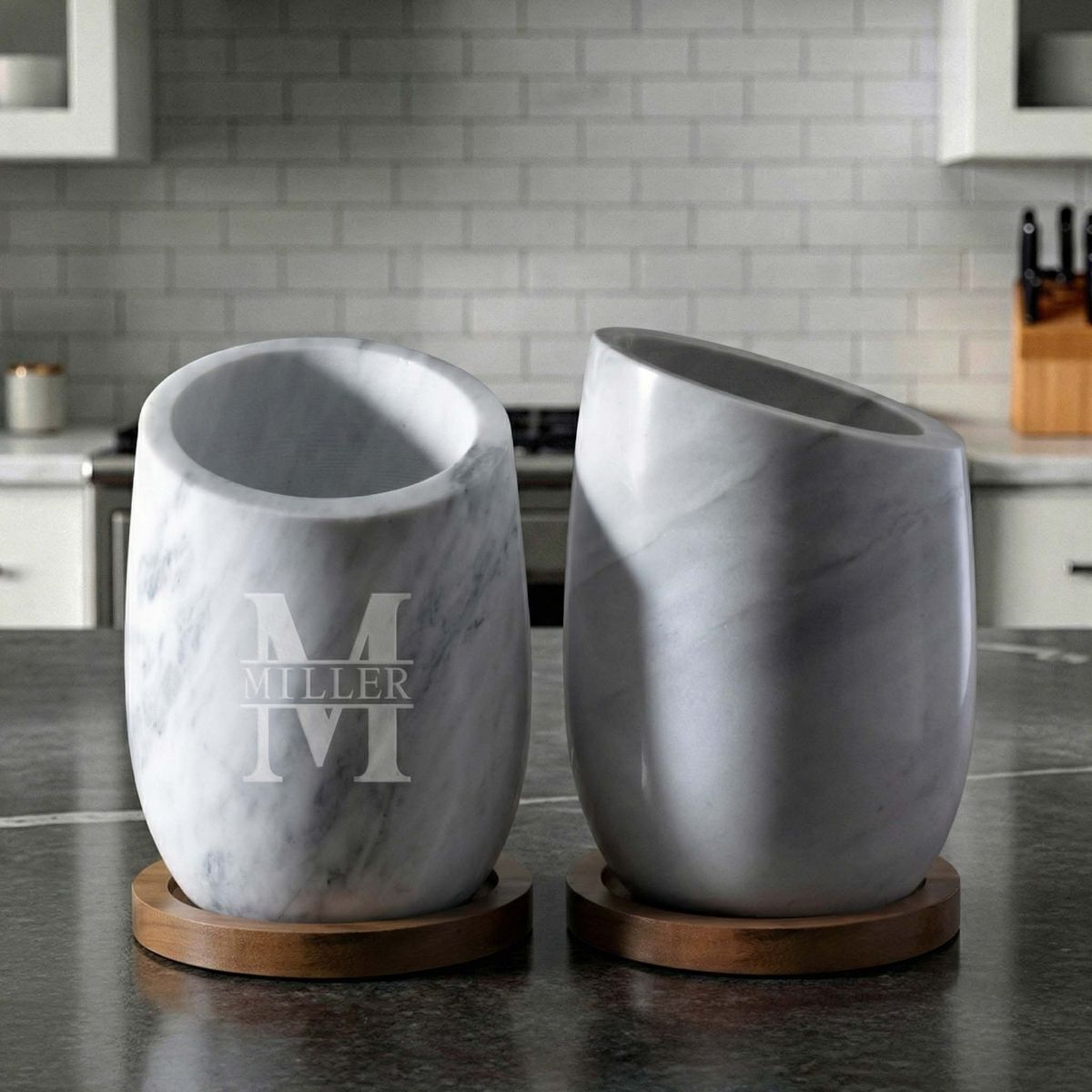 Two white marble wine chillers with engraving