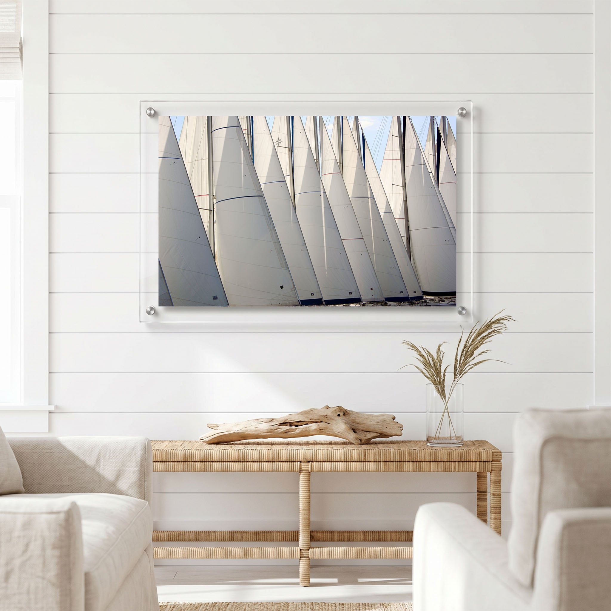 Nautical wall art showing overlapping white sails displayed in a bright room