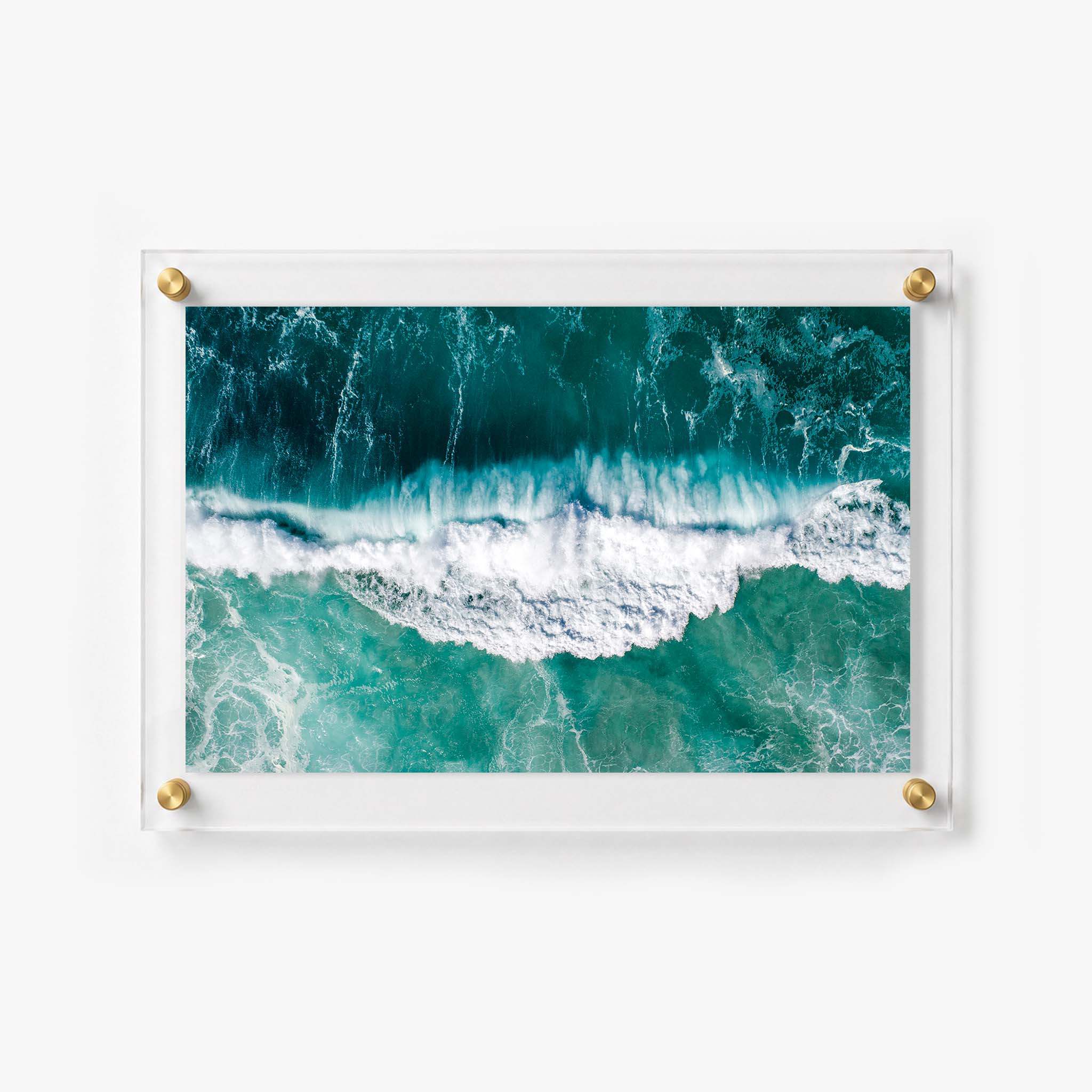 Horizontal ocean wall art featuring foamy waves and rich blue green water
