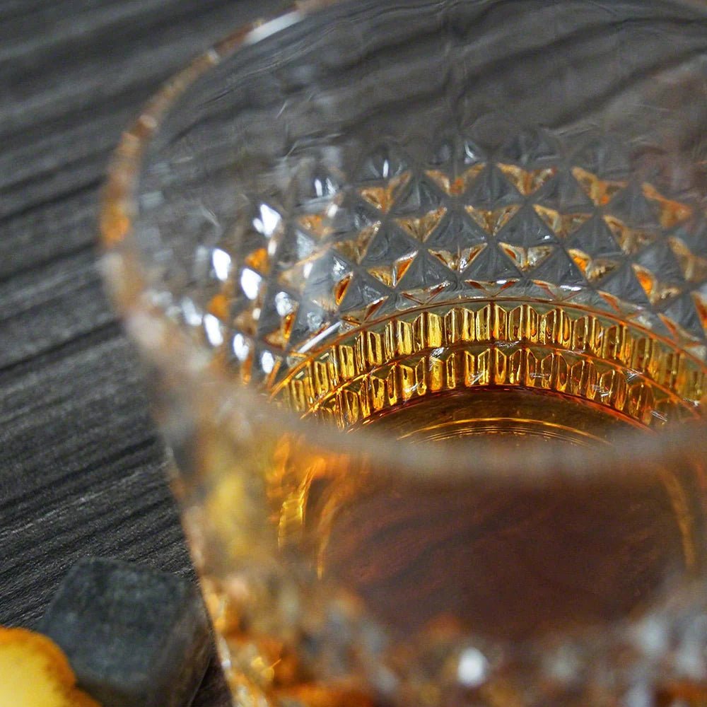 Close-up of the whiskey glass featuring its cut-crystal design.