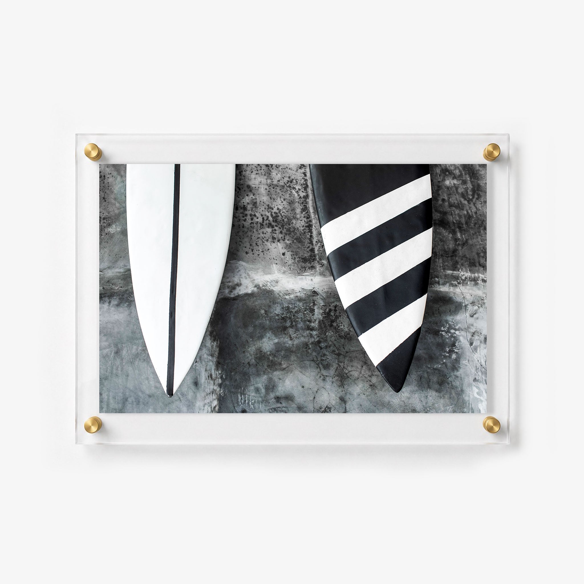 Horizontal acrylic print showing two surfboards with bold geometric designs
