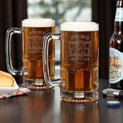 Two glasses of beer with 'Peter Smith' branding on a table with a bottle of beer and bread.