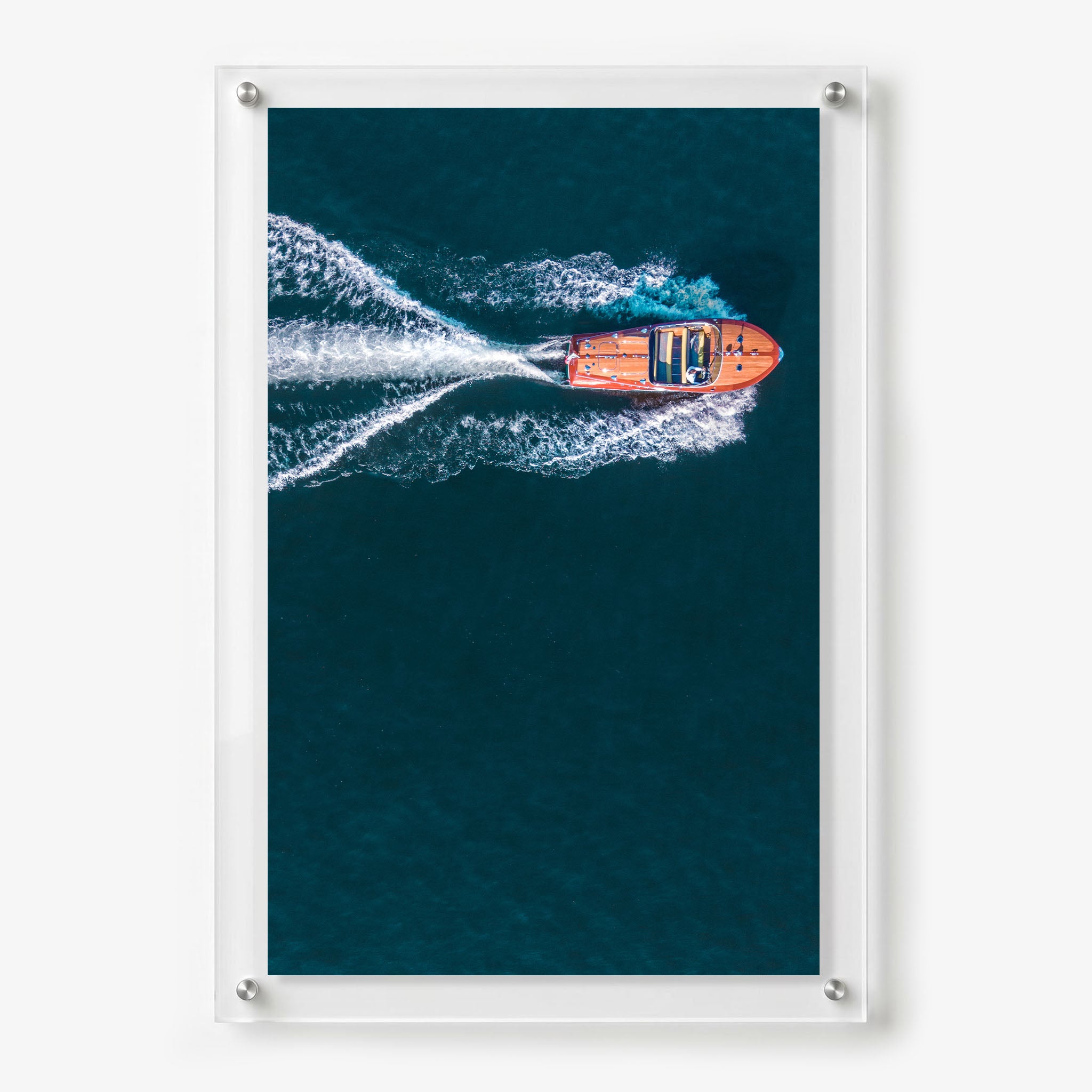 Acrylic wall art featuring a wooden speedboat creating a white wake