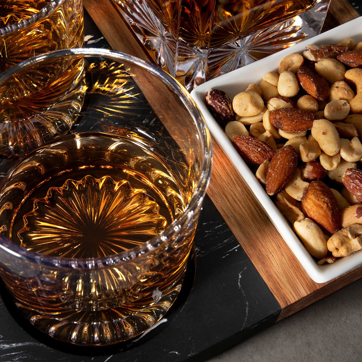 Marble Serving Tray w/ Whiskey Decanter & Churchill Glasses and nuts, close up shot
