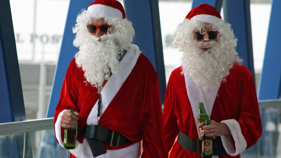 Santa Clauses Drinking Beer