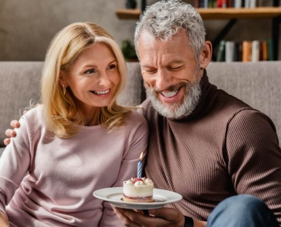 Man celebrating 70th birthday with wife