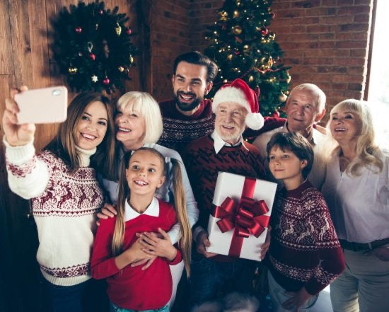 Family Giving Christmas Gifts to Parents