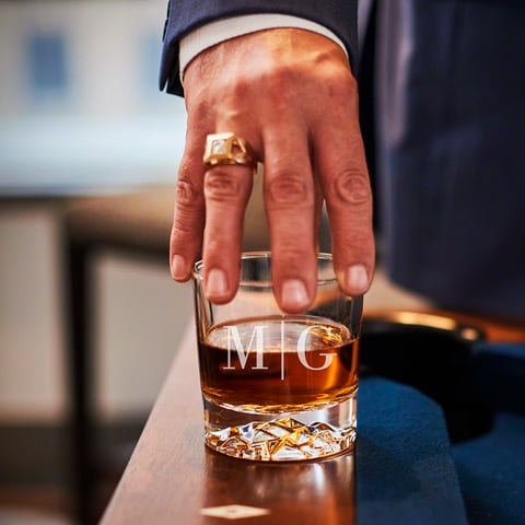 man holding glacier bottom bourbon glass